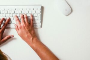 Hands on a Keyboard Making Website Changes