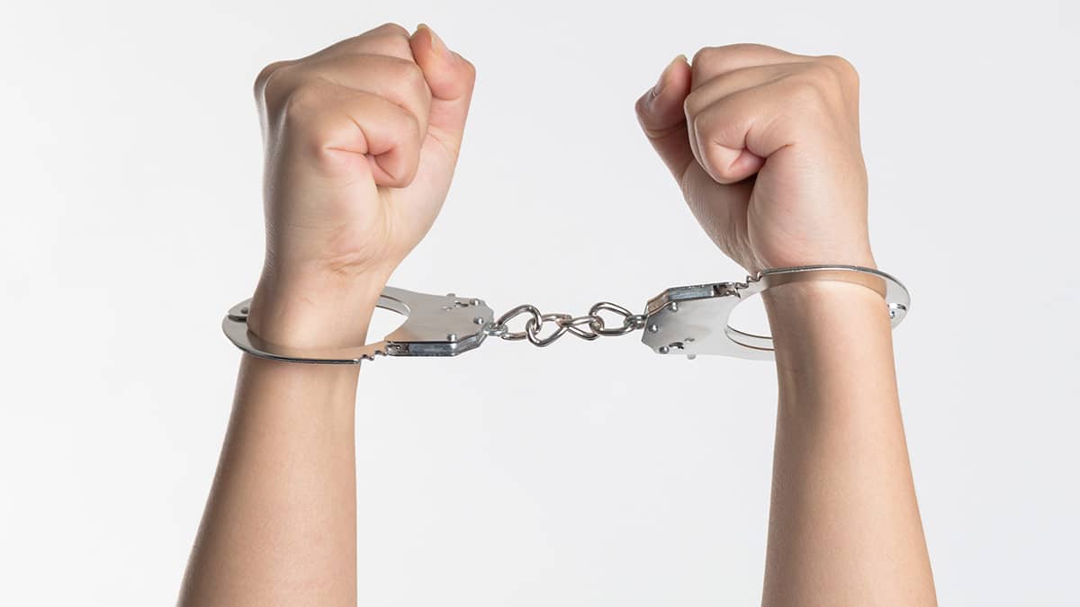 Handcuffs to symbolize rules and regulations for influencer marketing